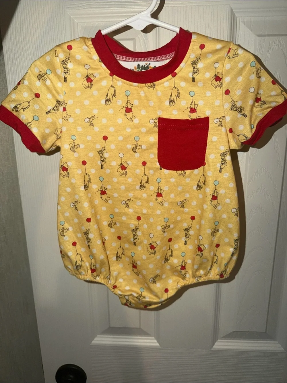 Yellow Winnie the Pooh Pocket Romper with Red Trim